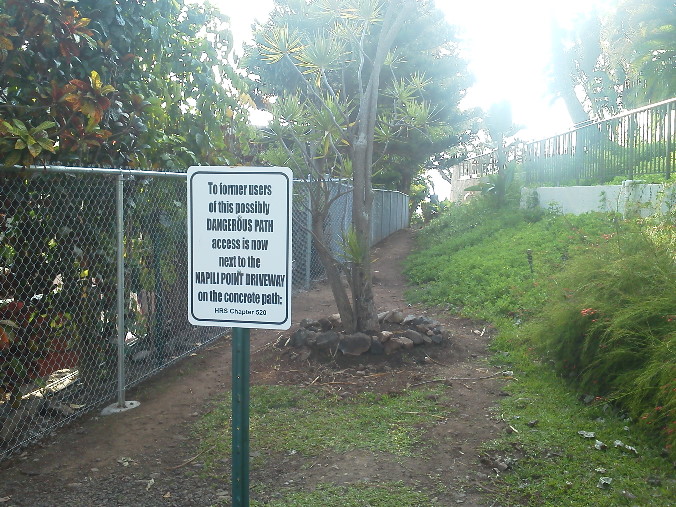 PIcture of path to beach with "Dangerous Path" sign